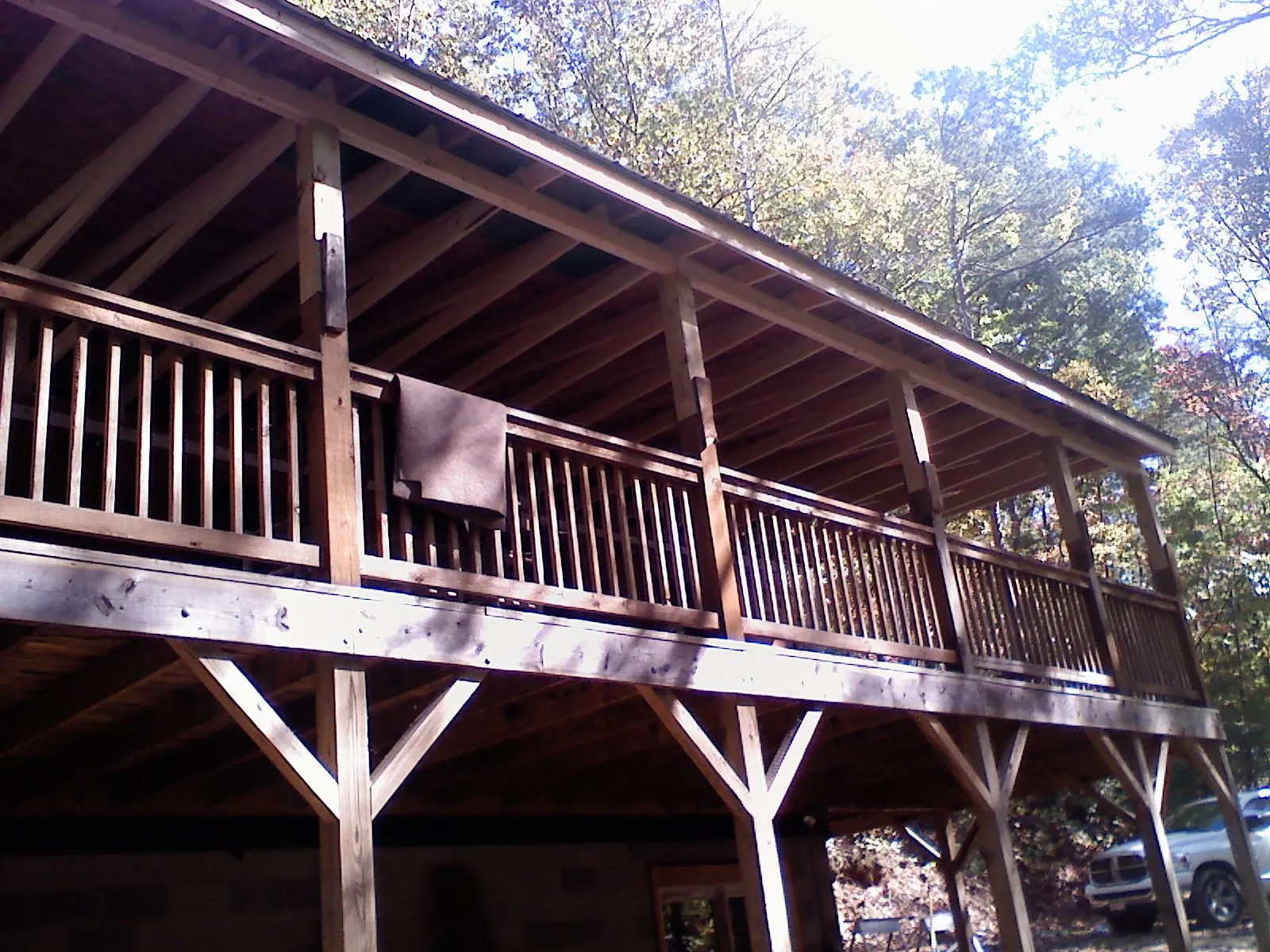 Timber framing under a new elevated porch and deck — Roof Leak Repair in Savona by Roofing Brothers