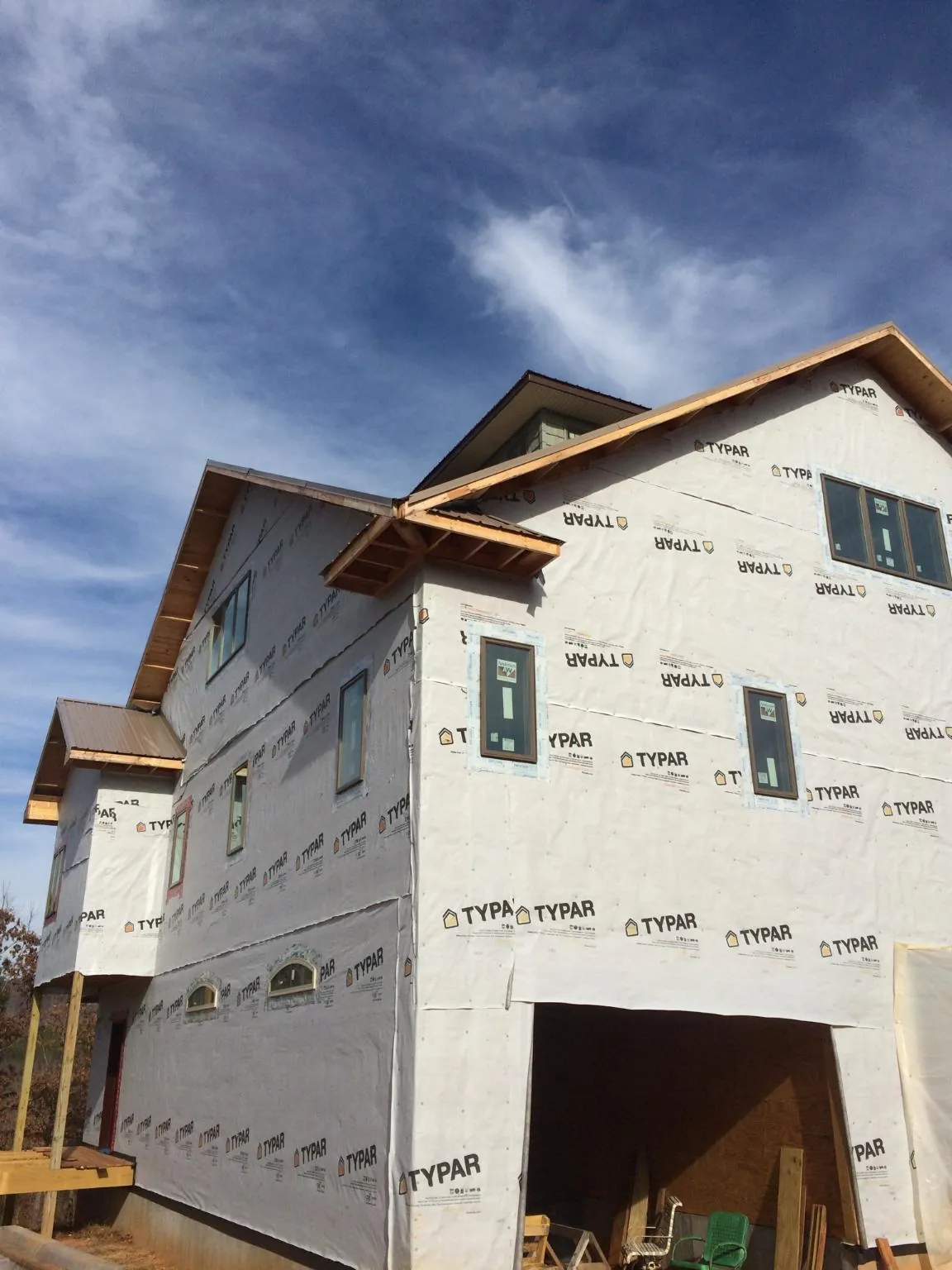 Stick built house wrapped in Typar with new roof framing and dormers in Savona